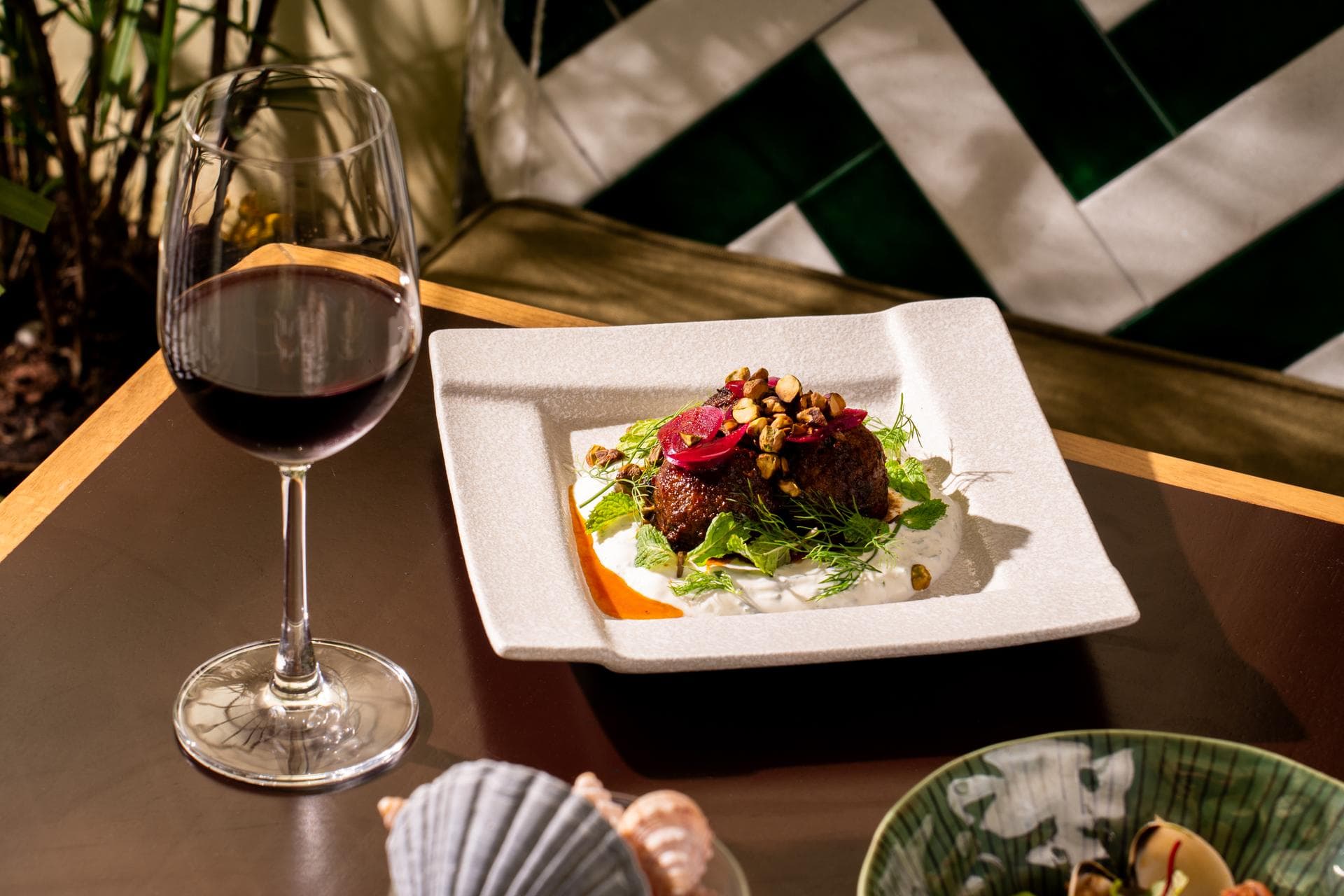 Main course dish with red wine